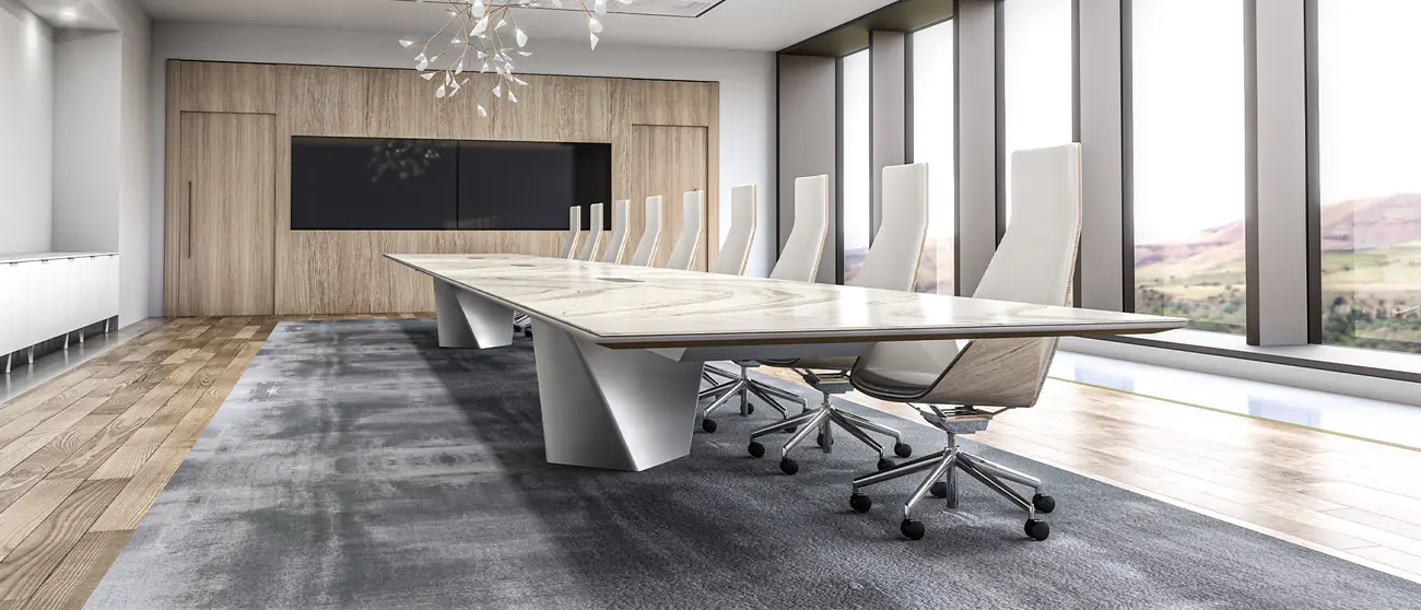Finished boardroom installation with stone-top conference table and mountain view